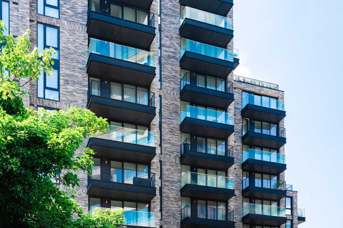 Modern apartment building exterior with balconies.